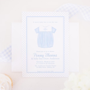 Puede incluir: Una invitación a un baby shower con un diseño azul claro y blanco. La invitación presenta una ilustración de pelele azul con las iniciales "DBA". El texto incluye "A sweet baby boy is on the way" y detalles de la fiesta.