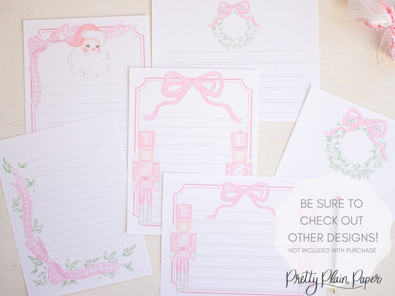 May include: Set of pink and green Christmas stationery featuring a nutcracker, a wreath, and a bow. The stationery has lined paper for writing letters.