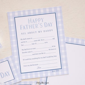 May include: A printable Father's Day card with a blue and white gingham pattern. The card has fill-in-the-blank questions about the recipient's father. The text on the card reads "Happy Father's Day, All About My Daddy".
