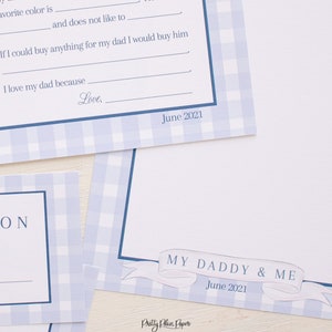 May include: A blue and white gingham patterned printable card with the text "My Daddy & Me" and "June 2021". The card is designed for a child to write about their father.