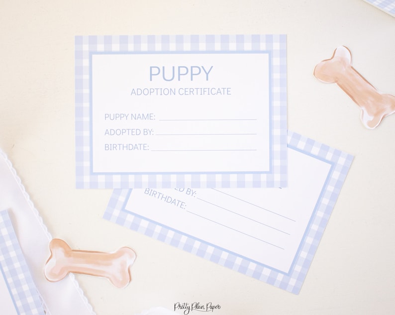 May include: Two blue and white gingham puppy adoption certificates with the text "PUPPY ADOPTION CERTIFICATE" and blank lines for the puppy's name, adopted by, and birthdate.