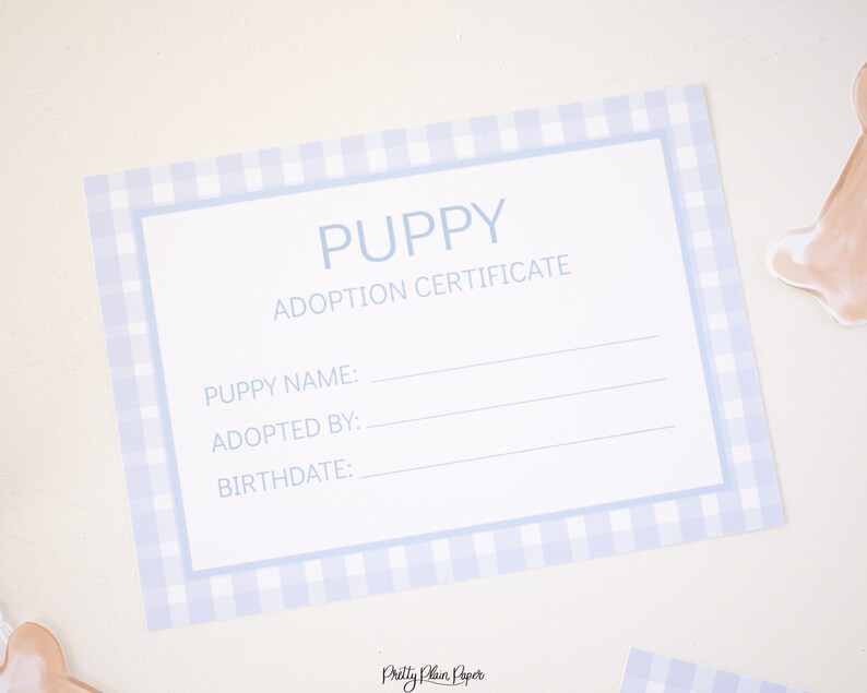 May include: A blue and white gingham puppy adoption certificate with the text "Puppy Adoption Certificate" and blank lines for the puppy's name, adopted by, and birthdate.