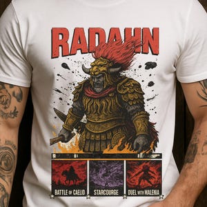 May include: White t-shirt featuring a graphic of a warrior with the name "RADAHN" in red block letters. Below the warrior are three panels with text: "BATTLE OF CAELID", "STARCOURGE", and "DUEL WITH MALENIA".