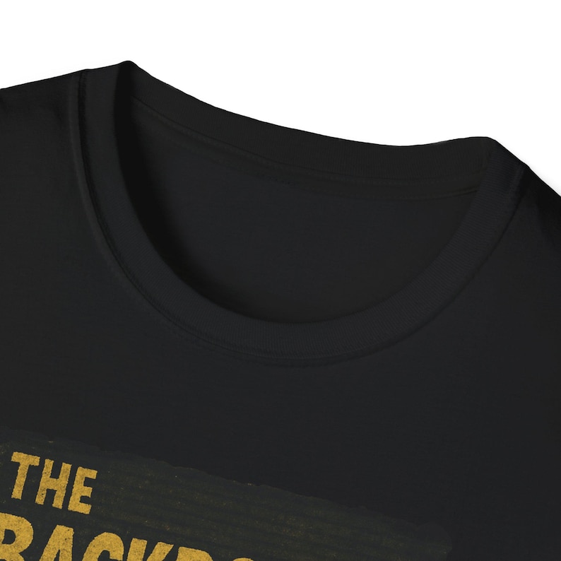 Viral Backrooms horror image on black T-shirt, with yellow fluorescent maze and shadowy entity, popularized by TikTok, YouTube horror ARGs, and Reddit lore fans.
