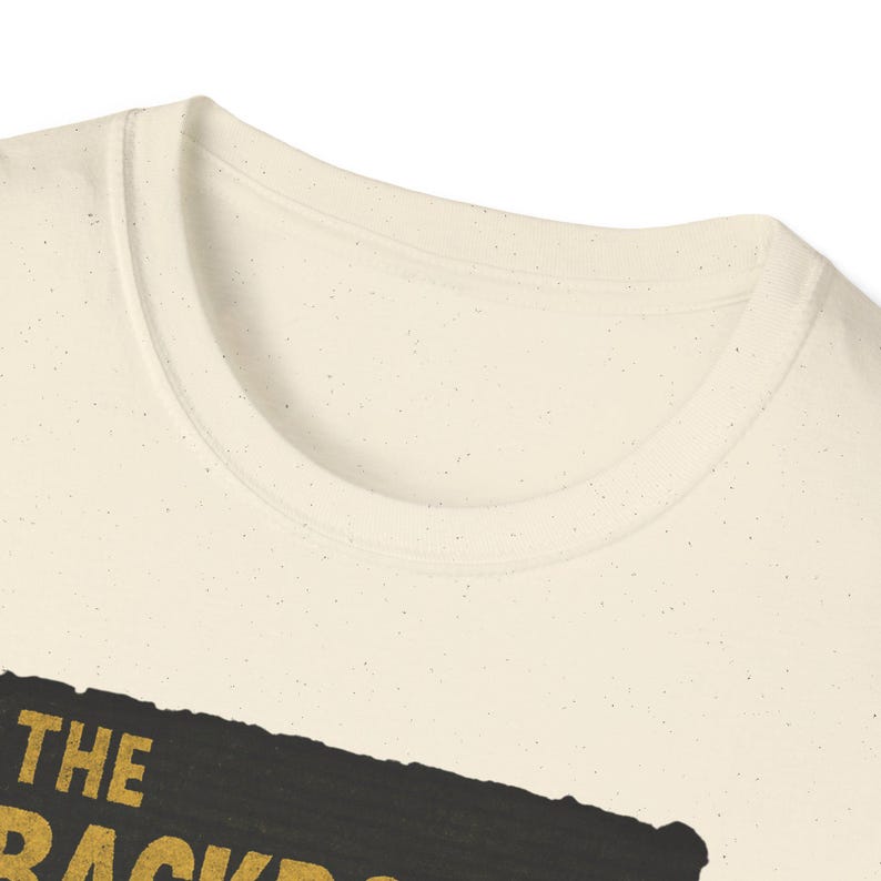 Backrooms horror graphic tee with liminal space hallway art, shadow figure, and vintage grain effect; printed on high-quality black cotton T-shirt for creepypasta and analog horror fans.