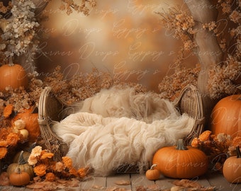 May include: A wicker basket with a white fabric blanket inside, surrounded by fall-themed decor, including pumpkins, dried flowers, and leaves.