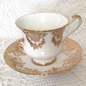 Stunning white and gold Paragon fine bone china cup and saucer