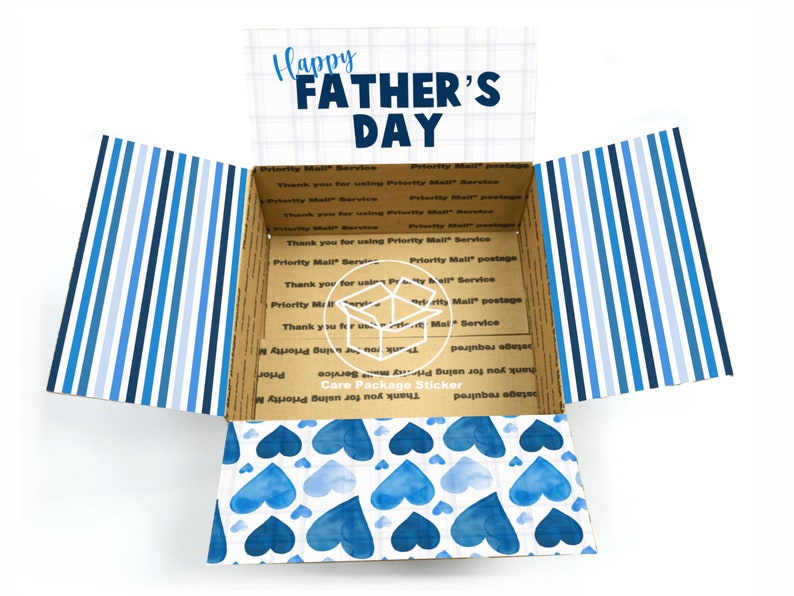 May include: Open cardboard box with a blue and white striped pattern on the outside and a blue watercolour heart pattern on the inside. The box has a sticker on the inside that says "Care Package Sticker" and "Thank you for using Priority Mail Service". The top of the box has the text "Happy Father's Day" printed on it.