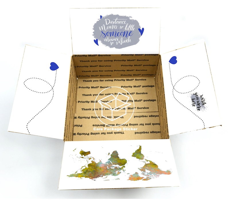 May include: A white cardboard box with a world map printed on the inside. The box is open and the top flap is folded back. The outside of the box has a blue and gray design with the text "Distance means so little someone means so much".