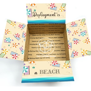 May include: A brown cardboard box with a beach-themed design. The box is open and the inside is lined with a blue and white striped pattern. The box has a sticker on the front that says "Deployment is a BEACH".