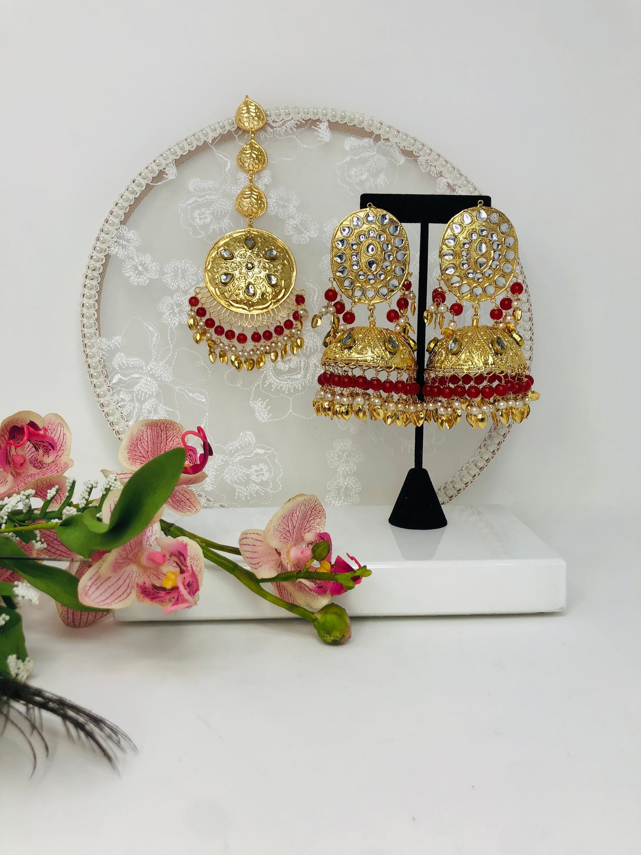 Maroon colour jhumka earrings and tikka set with pipal Patti in tradit –  Timeless desires collection