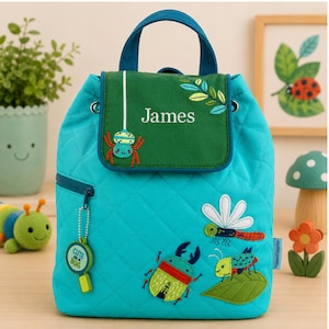 May include: A quilted turquoise backpack featuring a dark green flap embroidered with the name James and a spider. The bag displays colorful insect appliques including a beetle, dragonfly, and bug on a leaf, plus a magnifying glass zipper pull.
