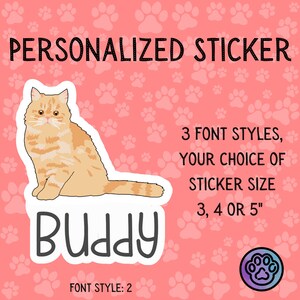 May include: Personalized sticker featuring a cartoon orange tabby cat with the name "Buddy" in a white outline. The sticker is available in 3 font styles and 3 sizes: 3, 4, or 5 inches.