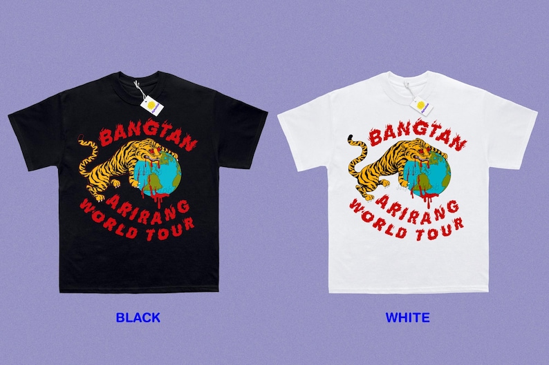 May include: Black and white t-shirts with a graphic design. The design features a tiger over a globe with the words "BANGTAN ARIRANG WORLD TOUR" in red. Each shirt has a tag attached.