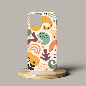 May include: A white phone case with a colorful abstract pattern of green, yellow, orange, and brown shapes.