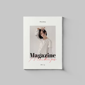 May include: A magazine mockup featuring a woman with short black hair wearing a white top and a white scarf. The text "Magazine Mockups" is printed in black with the word "Mockups" in red cursive. The text "8.5x11" is printed in black below the title.