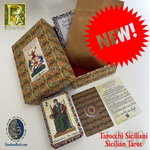 May include: A tarot card set with a patterned box and cards. The box features a colorful geometric design and a label with the text "TRINACRIA 1930". The cards display illustrations and the text "L'Imperatrice The Empress". A red "NEW!" starburst is visible.