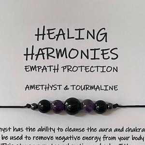 May include: A black string bracelet with amethyst and black tourmaline beads. The card reads "Healing Harmonies Empath Protection Amethyst & Tourmaline". Amethyst is known to cleanse the aura and chakras, while black tourmaline is known for its protective properties.