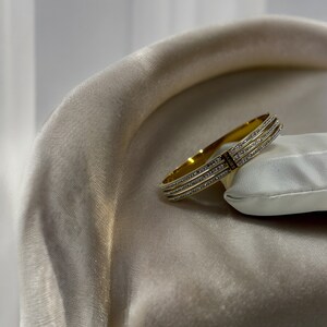 Lujosa pulsera de acero inoxidable Cartier en oro y diamantes