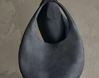 Genuine Leather Hobo Bag: Round Shape, Hand-Sewn Handle, Structured Base, Minimalist Design