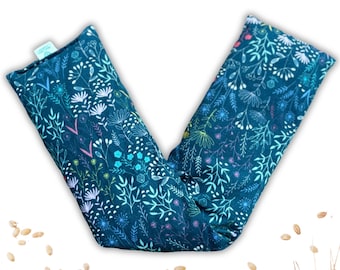 May include: A teal blue fabric eye pillow with a floral pattern. The pillow is filled with grains and is designed to be heated or chilled for relaxation.