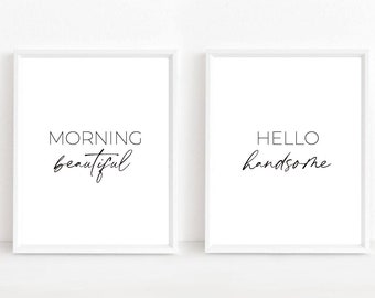 May include: Two white framed prints with black text. The left print says "Morning beautiful" and the right print says "Hello handsome".