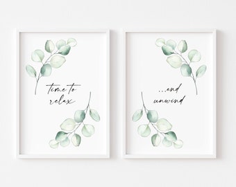 May include: Two white framed prints with green watercolour eucalyptus leaves and the text "Time to relax... and unwind".