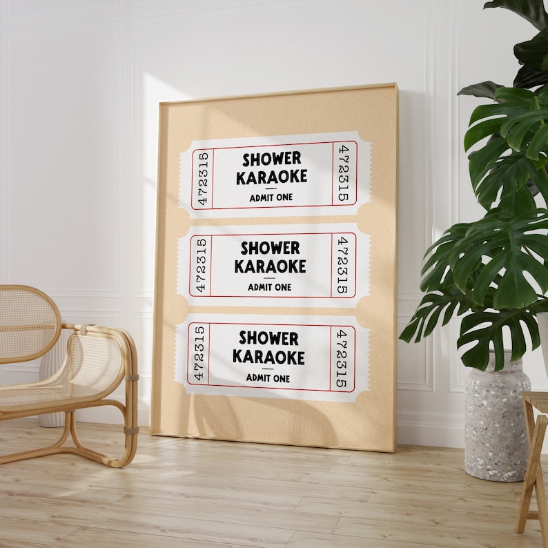 May include: Three vintage-style ticket stubs with the text "Shower Karaoke" and "Admit One" printed on them. The tickets are displayed on a corkboard.