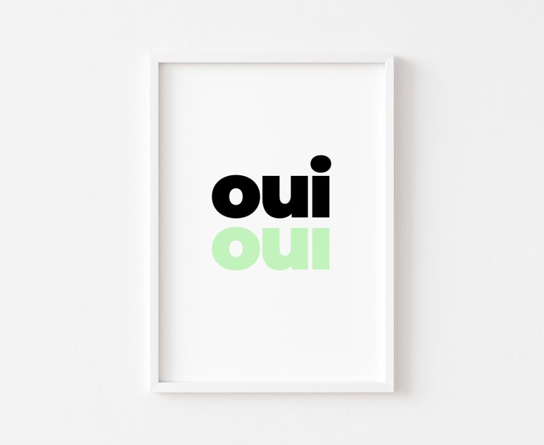 May include: A framed print with the word "oui" written twice, once in black and once in light green.