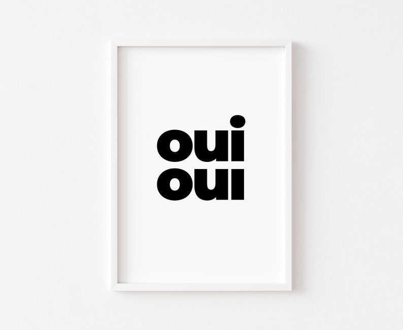 May include: A white framed print with the word "oui" repeated twice in black bold font.