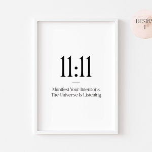 Może przedstawiać: Biały wydruk w ramie z liczbą 11:11 w czarnym kolorze. Tekst poniżej brzmi "Manifest Your Intentions The Universe Is Listening".