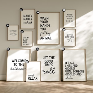 May include: A collection of framed bathroom art prints with humorous quotes in black text on white backgrounds. The prints include phrases like "Wash Your Hands You Filthy Animal" and "Welcome to the Bathroom."
