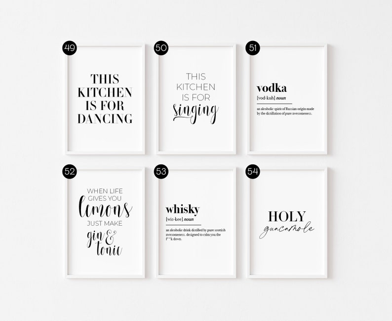 May include: Set of six white framed prints with black text. The prints feature kitchen-themed sayings and definitions of alcoholic beverages. The text includes "This kitchen is for dancing", "This kitchen is for singing", "Vodka", "When life gives you lemons, just make gin & tonic", "Whiskey", and "Holy guacamole".