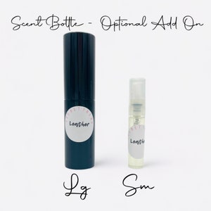 May include: Two clear glass bottles with black caps and white labels. The labels say "Secret Trend Lenther". The bottles are labeled "Lg" and "Sm" for large and small.