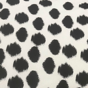 Black polka dot ITY Fabric, black edgy spot on white knit, very soft opaque drapey fabric, dress fabric, polyester city, irregular dot print