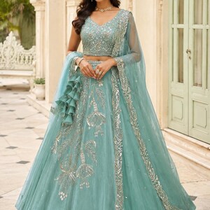 Mint Green silk lehenga choli with intricate beads embroidery, designer Indian wedding outfit, bridal engagement wear with net dupatta and embroidered blouse.