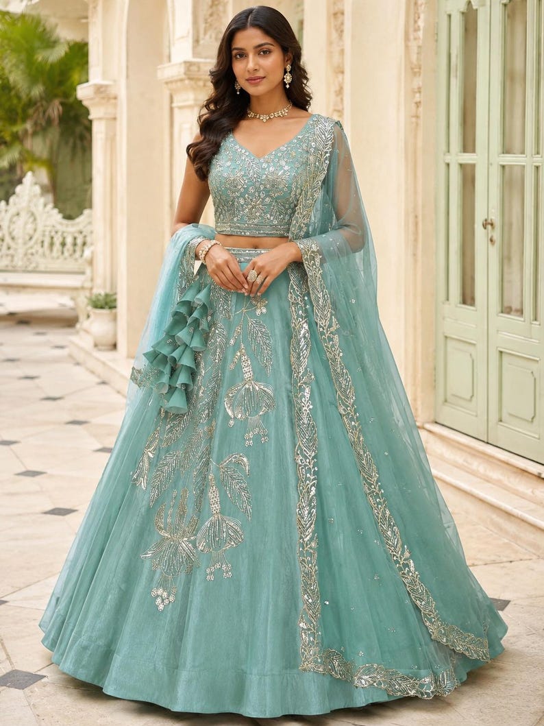 Mint Green silk lehenga choli with intricate beads embroidery, designer Indian wedding outfit, bridal engagement wear with net dupatta and embroidered blouse.