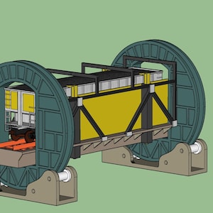 May include: A yellow and black industrial machine with two large green wheels on either side. The machine is on a stand with a metal frame.