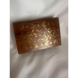 Vintage wooden box with brass inlay