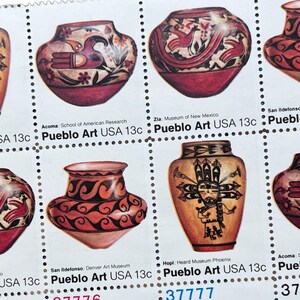May include: A sheet of Pueblo Art USA 13c stamps. The stamps feature colorful illustrations of pottery with intricate designs. The text on the stamps includes "Acoma", "Zia", "San Ildefonso", and "Hopi".