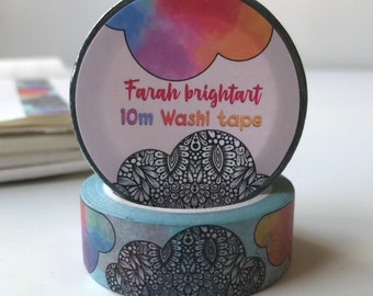 May include: A roll of washi tape featuring a colourful watercolour cloud design and a black and white mandala pattern. The tape is labelled "Farah brightart 10m Washi tape".