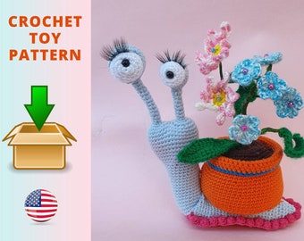 May include: Crochet pattern for a blue snail carrying a pot of pink and blue flowers. The pattern is available for download.  CROCHET TOY PATTERN
