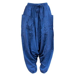 May include: Blue cotton pants with a drawstring waist and large pockets on the sides.