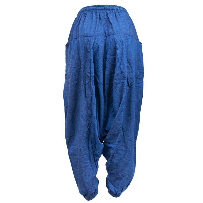 May include: A pair of blue cotton pants with a loose, flowing fit. The pants have a drawstring waistband and a wide leg.