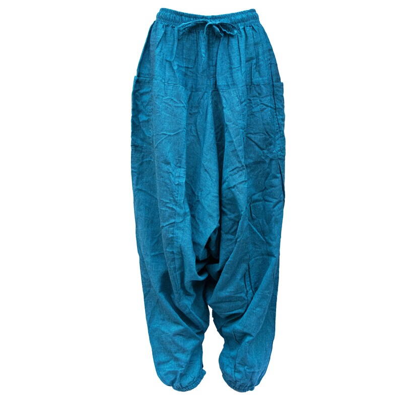 May include: A pair of blue cotton pants with a drawstring waist and side pockets. The pants are loose fitting and have a baggy style.