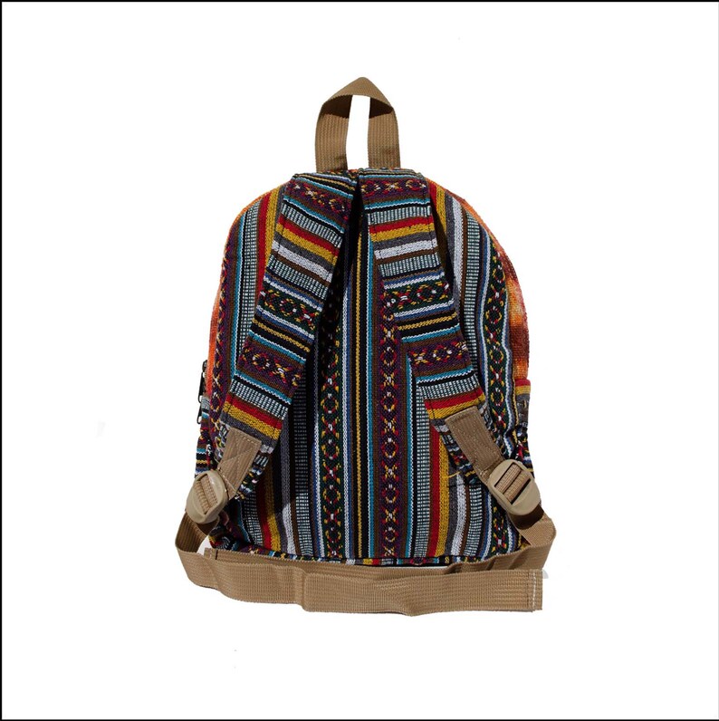 May include: A multi-colored striped backpack with brown straps and buckles. The backpack is made of woven fabric with a geometric pattern.