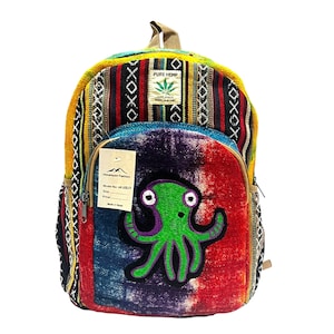May include: A vibrant backpack with a tie-dye front panel and a green octopus motif. The bag features a mix of patterns and colours, including red, blue, yellow, and black. The text "PURE HEMP" is visible on the top.