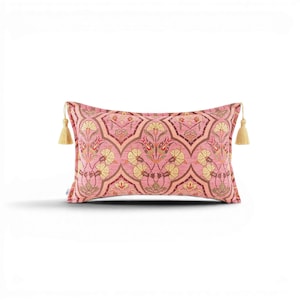 May include: A rectangular decorative pillow with a pink floral pattern and gold tassels on each end. The pillow's design features a repeating pattern of stylized flowers in shades of yellow, pink, and brown. The pillow measures approximately 20 inches long.