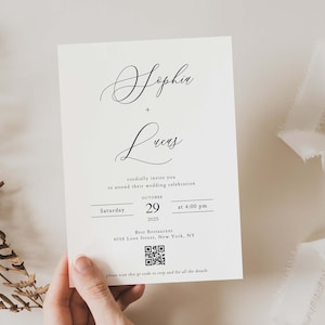 May include: A cream-colored wedding invitation with elegant calligraphy announcing the marriage of Sophia and Lucas. The invitation includes the date, time, and location: October 29, 2025, at 4:00 PM, Best Restaurant, New York, NY. A QR code is also included.