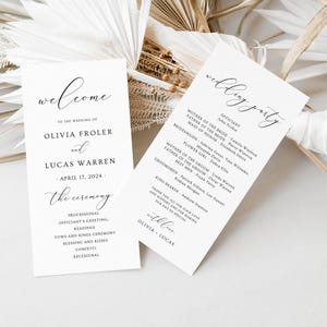 May include: Two white wedding programs with black calligraphy. One reads "Welcome" and lists the couple's names and wedding date. The other lists the wedding party and thanks guests. Dried flowers are in the background.